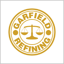 garfield refining logo alll gold with the name wrapped around a scale in the middle of the circle