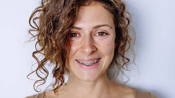 Person with braces smiling