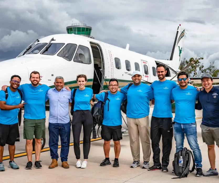 team by plane on cloudy day