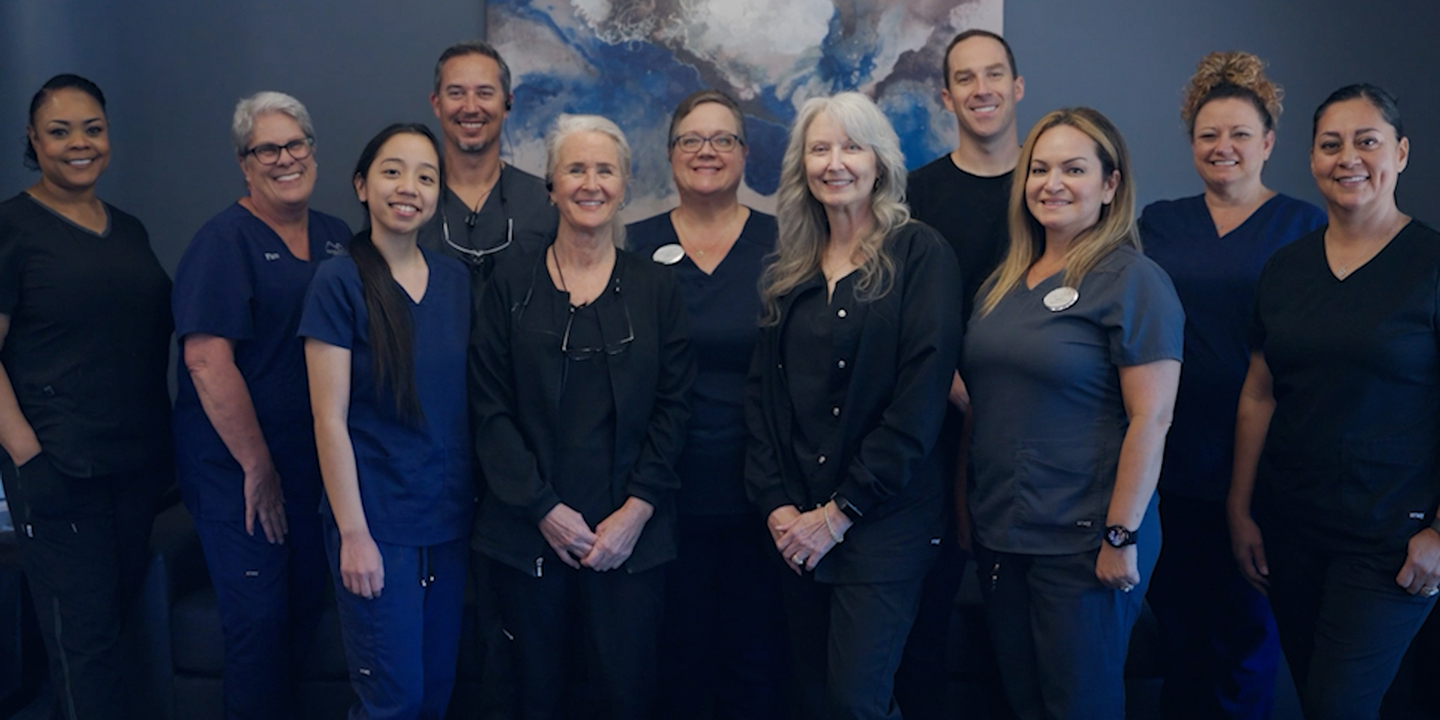 A group of dental workers posing for a photo