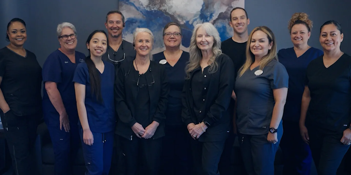 A group of dental workers posing for a photo